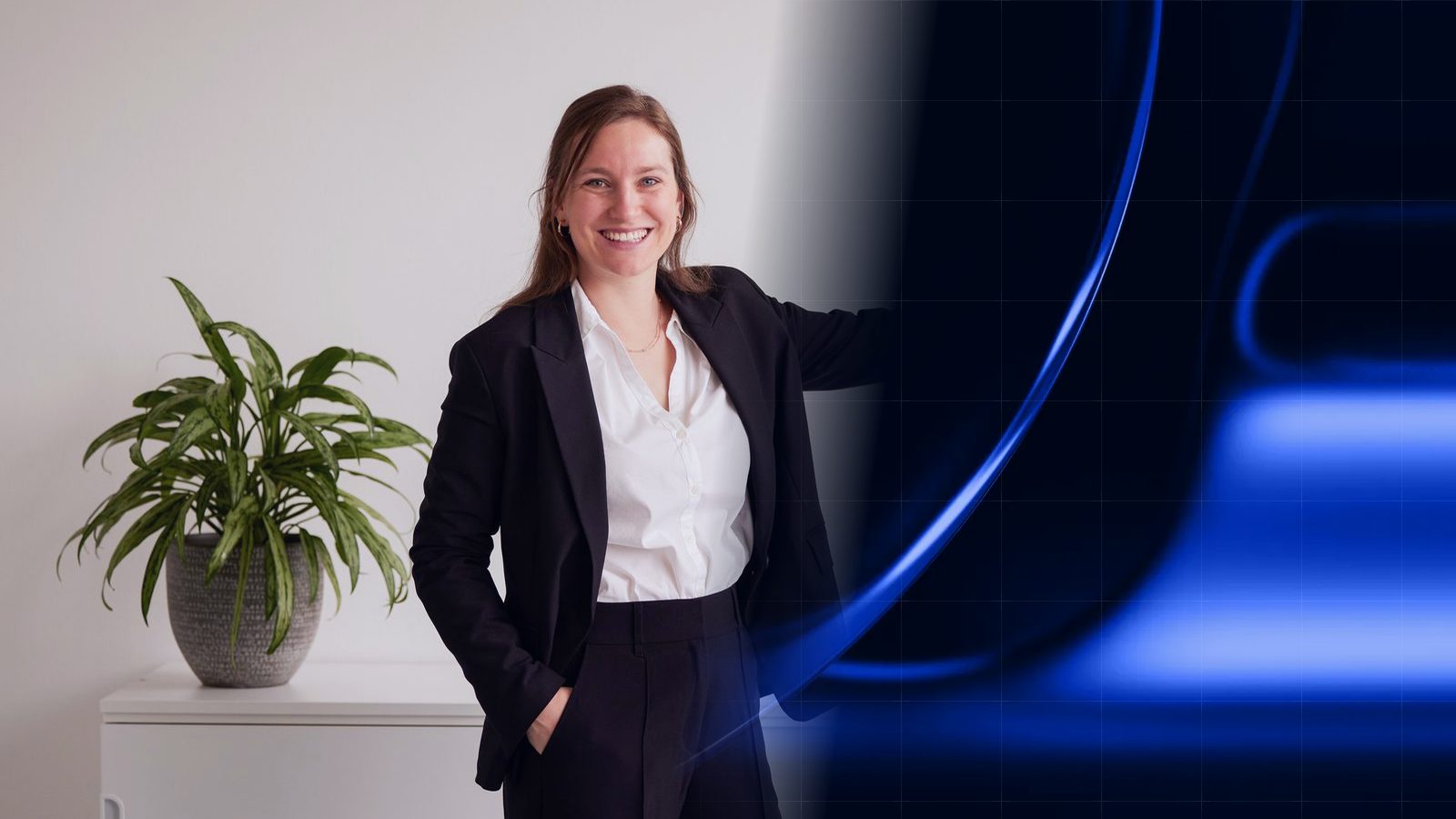 A smiling ReqPOOL consultant stands next to a potted plant and gestures to the right, where the photo fades into a blue pattern of soft color fields with a fine grid.